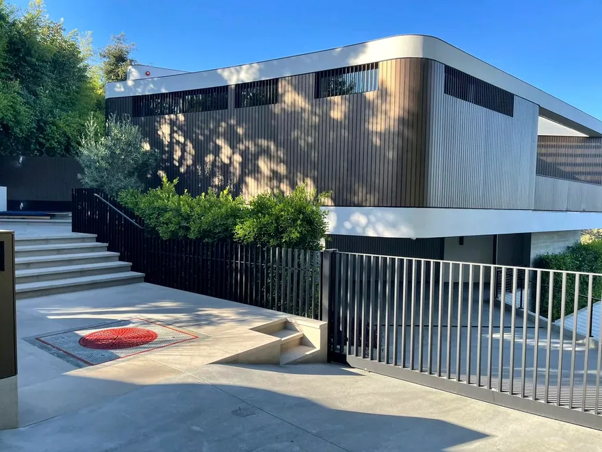 Curved custom metal cladding on modern home