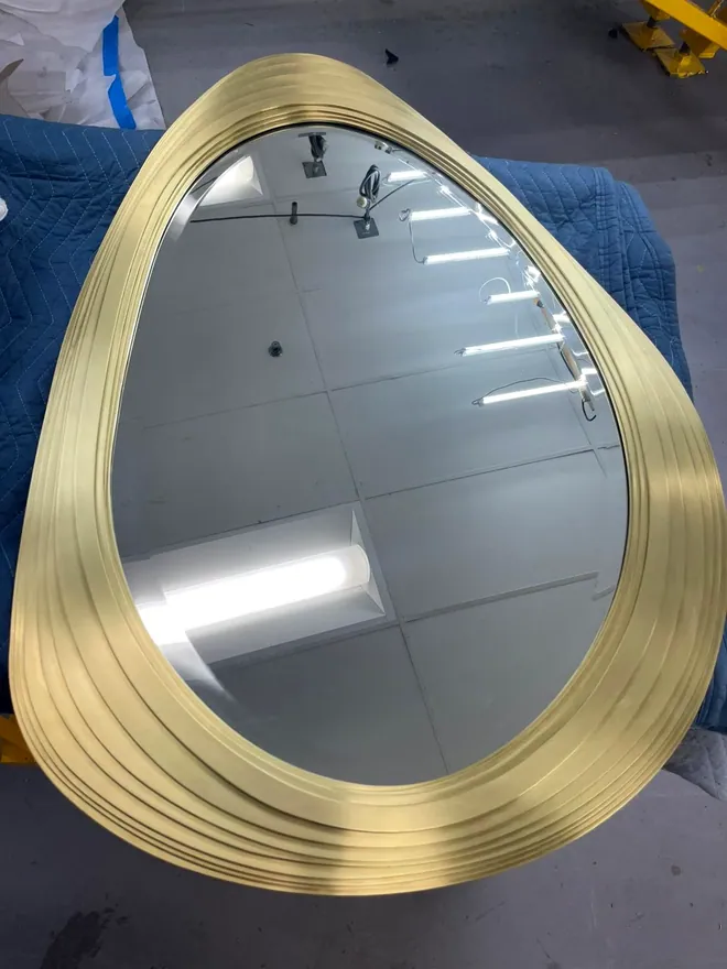 Sculptural layered brass frame mirror